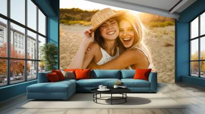 Two young caucasian happy women smiling and hugging together outdoors Wall mural