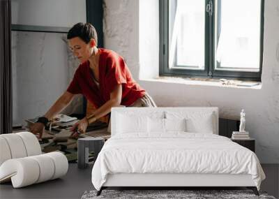 White female interior designer working at her workshop Wall mural