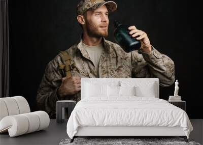 White military man wearing uniform drinking water from flask Wall mural