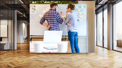 Woman and man discussing about business strategy Wall mural