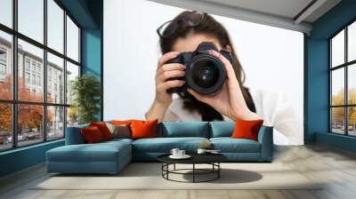 woman photographer with camera over gray background Wall mural