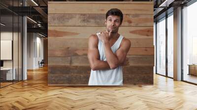 Young athletic european man think about something Wall mural