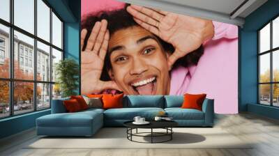 Young happy smiling handsome stylish latin curly man Wall mural