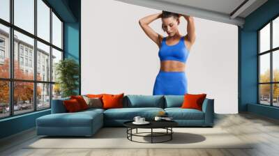 Young white fitness woman wearing sportswear Wall mural