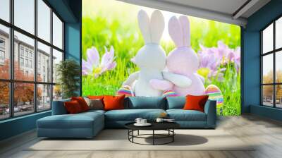 easter eggs in green grass with couple of easter rabbits  Wall mural