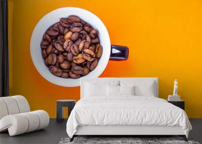 cup with coffee beans and colored paper background Wall mural