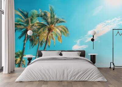 Palm trees and the bright blue sky as the background Wall mural