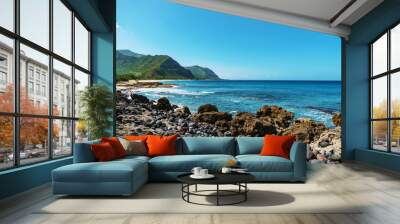 Rocky beach with mountains and ocean in background Wall mural