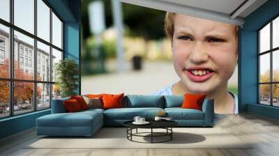 Close up portrait of emotion cute autistic boy Wall mural