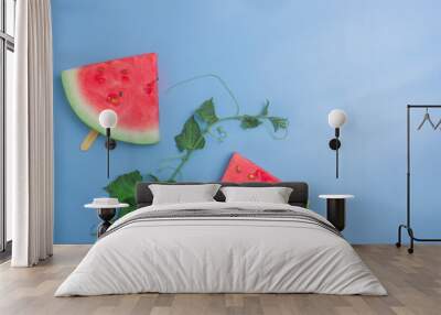 Fresh watermelon slices on sticks (seen from above). Wall mural