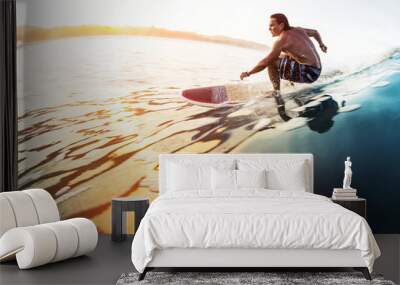 Surfer rides the glassy wave in tropics at sunrise. Costa Rica Wall mural