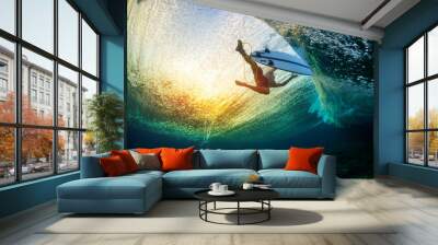 Underwater view of the surfer floating on the water surface after passing the big wave Wall mural