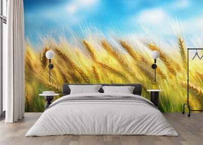 Close-up of wheat stalks blowing in the wind against a bright blue sky. Wall mural