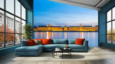 Night view of Place de la Bourse viewed over river Garonne from Stalingrad part of Bordeaux, France Wall mural