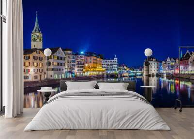 Night view of zurich from the munsterbrucke with building of the town hall on right side and saint peter church on left Wall mural