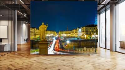 statue of king vittorio emanuele I is overlooking piazza vittorio veneto during night in the italian city torino. Wall mural