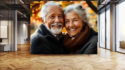 Enduring love and companionship of an elderly couple amidst vibrant autumn leaves Wall mural