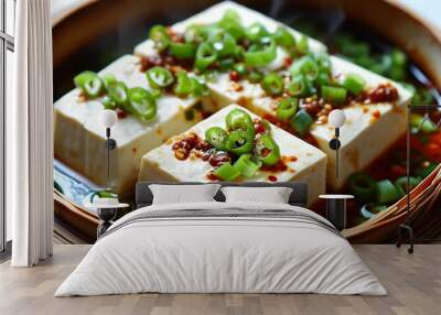 Flavorful steamed tofu cubes with chili sauce and fresh green onions in a traditional bamboo steamer Wall mural