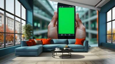 Smartphone display with blank green screen ready for app showcase in contemporary environment Wall mural