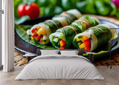 Vibrant traditional leaf-wrapped vegetable rolls on a black plate, highlighting fresh ingredients against a woven mat backdrop Wall mural