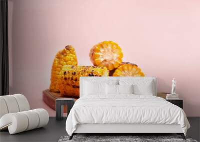 grilled corn on a pastel pink background, copies of space Wall mural