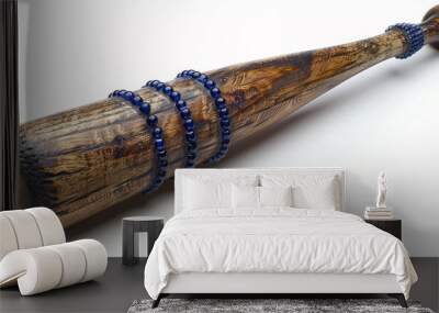 A baseball bat with a blue beaded handle is isolated on a white backdrop, shown in detail. Wall mural