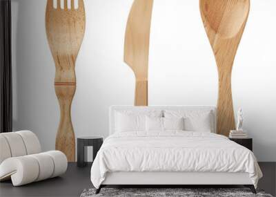 A simple flat wooden cutlery set, including one knife and two spoons on a transparent background. Wall mural