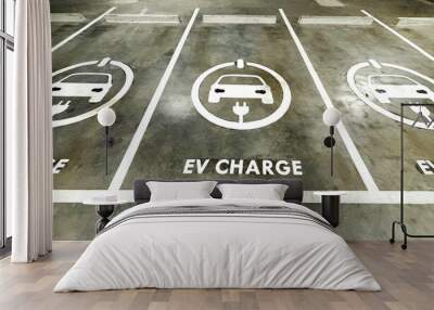 Empty space of EV charge parking lots in a business building, sign of EV charge on the ground of parking lots. Wall mural