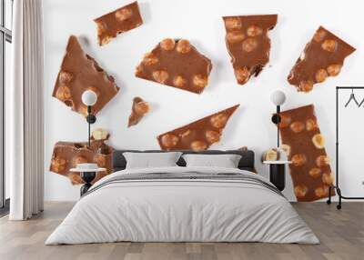 Chocolate bars set with hazelnut, pieces isolated on white background, top view Wall mural