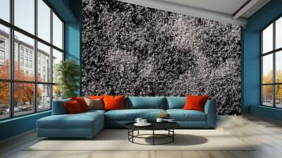 Himalayan salt pile isolated on black background, top view Wall mural