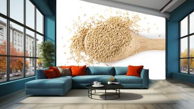 Organic integral sesame seeds with wooden spoon isolated on white background, top view Wall mural