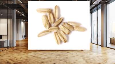 Peeled oat grains, groats pile isolated on white background, macro top view Wall mural