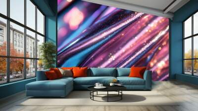 A close-up capture of an abstract swirl of colorful and shimmering metallic fabric, radiating vibrant hues of purple, blue, and pink, blending into each other. Wall mural