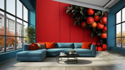 A cluster of ripe, red apples hang invitingly against a rustic red wooden wall, capturing the essence of a bountiful harvest and rustic charm in countryside style. Wall mural