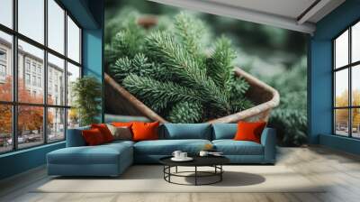 A collection of lush pine branches arranged in a weathered metal container, evoking a sense of rustic charm and natural tranquility, ideal for greenery displays. Wall mural