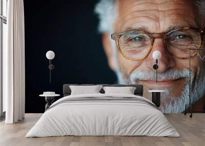 An elderly gentleman with glasses showcases wisdom and kindness, his thoughtful expression captured in a photo, serving as a timeless example of mature joy. Wall mural