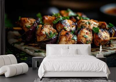 Tender grilled skewers featuring marinated chicken cubes and vegetables beautifully garnished with fresh herbs on flatbread, showcasing culinary delight. Wall mural