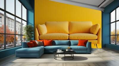 This image features a bright yellow couch set against a vibrant mustard yellow wall, creating a monochromatic and contemporary living room setting. Wall mural