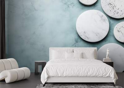 This image shows various circular objects featuring marble and speckled textures set against a smooth green background, blending natural and contemporary elements. Wall mural