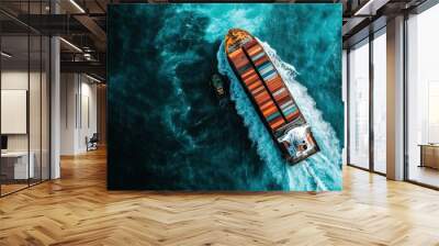 This stunning aerial shot captures a cargo ship, vibrantly stacked with containers, being escorted by a tugboat through the crashing blue waves of the sea in motion. Wall mural