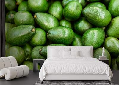 A big pile of avocados close up.. Fruit pattern. Wall mural