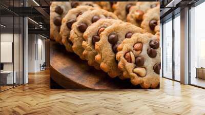 delicious cookies with chocolate and nuts on a wooden background Wall mural