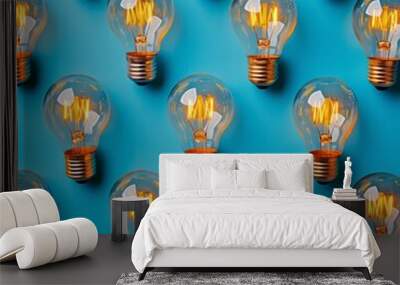 A row of light bulbs are lit up and arranged in a pattern Wall mural