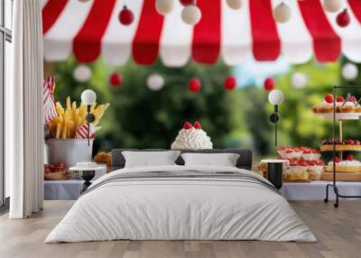 A table with a variety of desserts and a red and white striped canopy. The desserts include cakes, pies, and donuts Wall mural