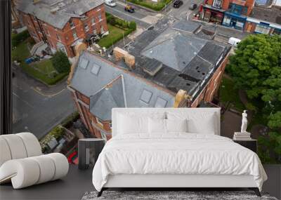 Aerial drone photo of the town centre of Scarborough in the UK, showing the roof and tiles of an historic vintage British house Wall mural