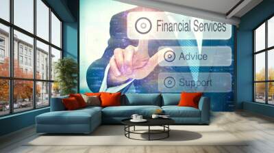 A business man selection a button on a futuristic display with aFinancial Services concept written on it. Wall mural