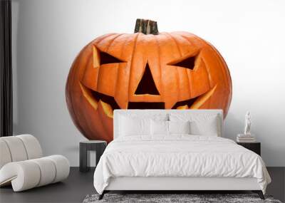 A carved halloween pumpkin with evil eyes and face isolated on white. Wall mural