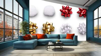 A collection of red, gold and white ribbon bows and gift, present wrapping decorations isolated against a white background. Wall mural