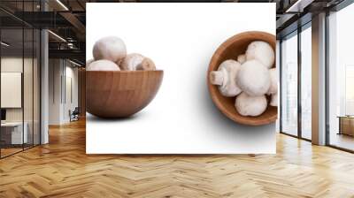 A collection of wooden bowls full of Champignon, white button mushrooms isolated against a white background Wall mural