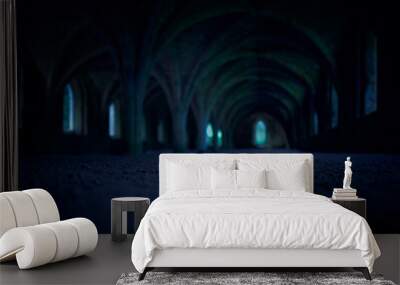 A dark and spooky background of arches in the dungeon of an old monastery, castle at night. Wall mural